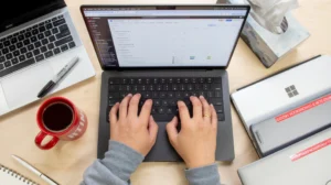 Remote job search setup with laptop and coffee